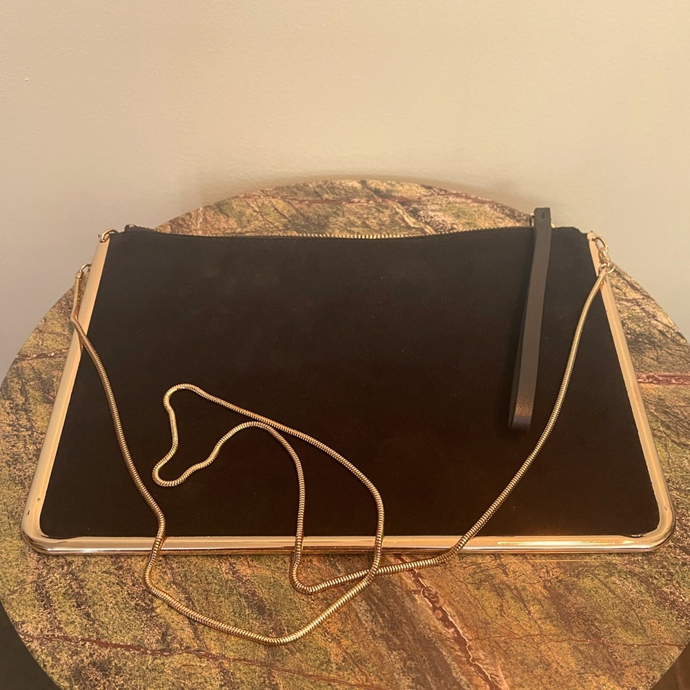 Women’s black and gold clutch purse